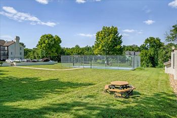 Outdoor basketball court and open green space